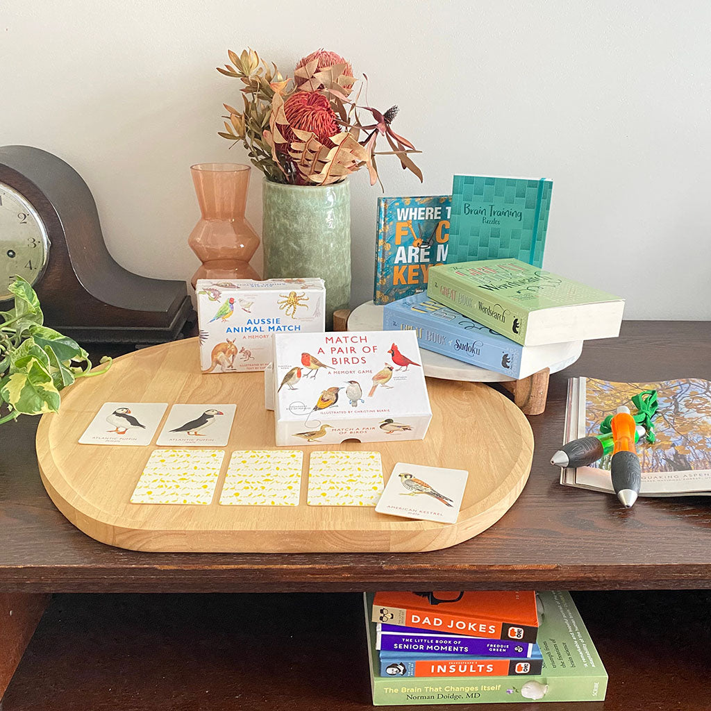 Books, memory games and puzzle books on a shelf