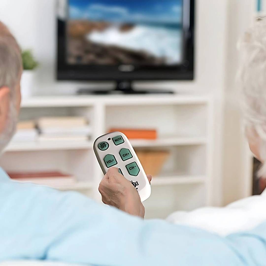 Couple watching TV using the big button TV remote control