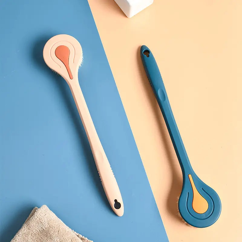 two long handled back scrubbers on contrasting backgrounds