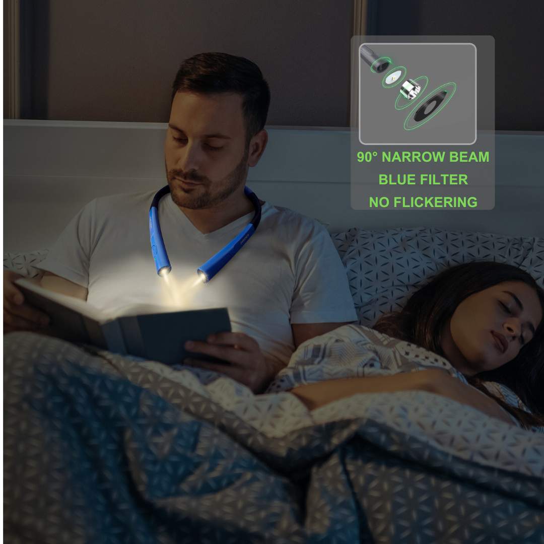 man using the neck light for reading a book while partner is sleeping