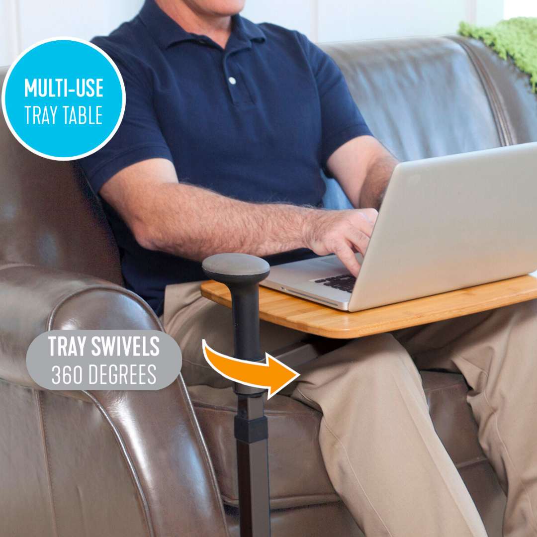 Man using his notebook on the omni tray