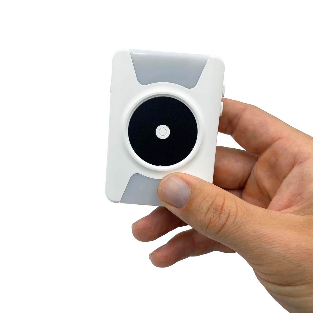 hand holding portable vibrating door bell ringer