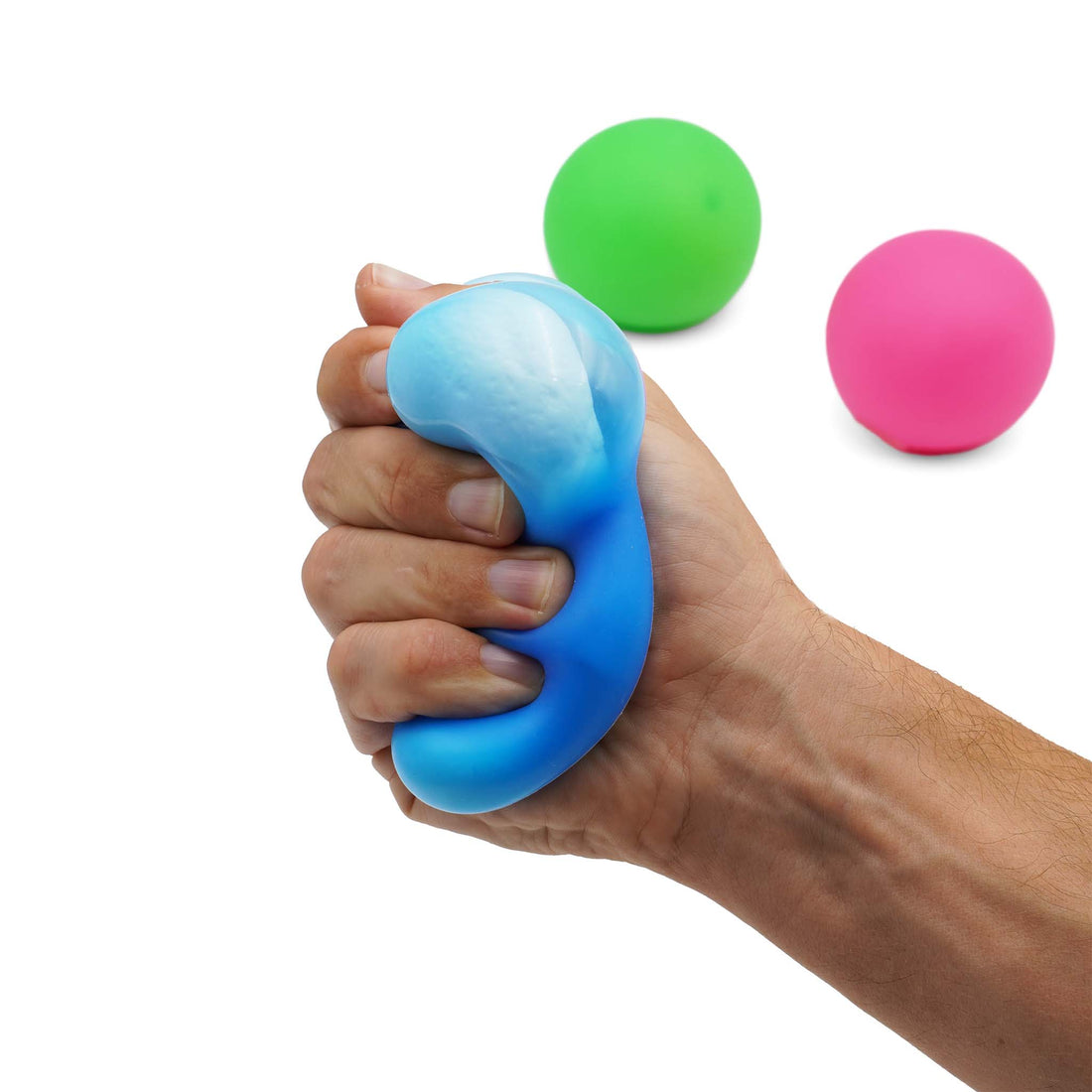blue sensory squishy ball squished in hand with green and pink sensory squishy balls in the background