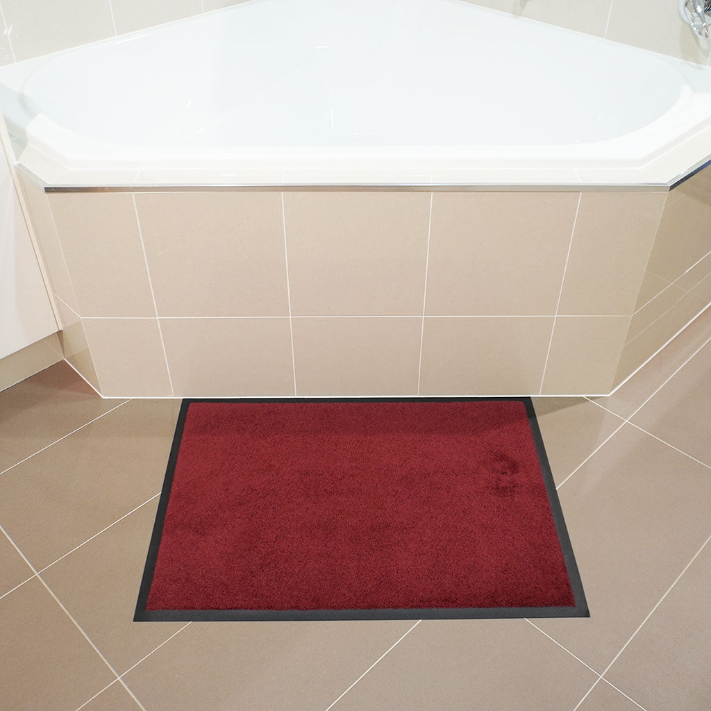 Betterliving heritage red large non-slip mat in front of bathtub
