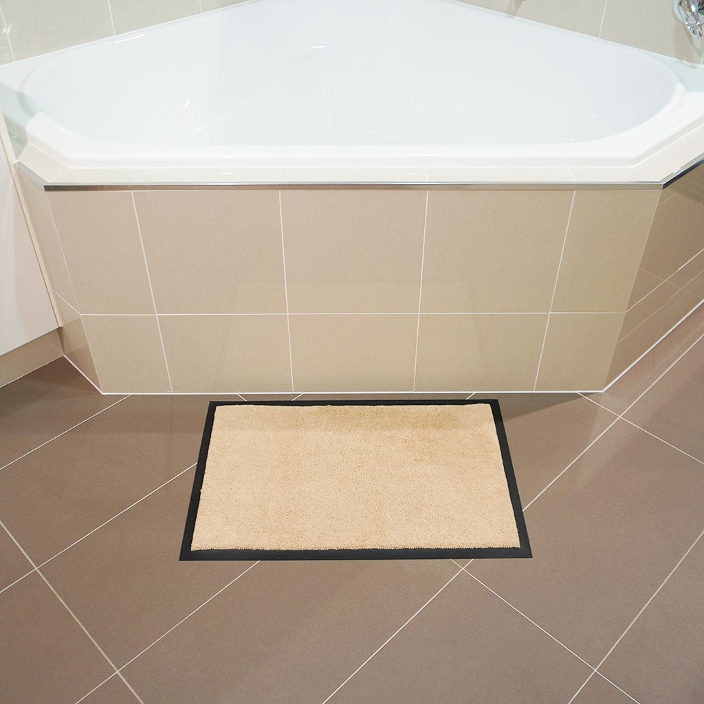 Betterliving beige small non-slip mat in front of bathtub