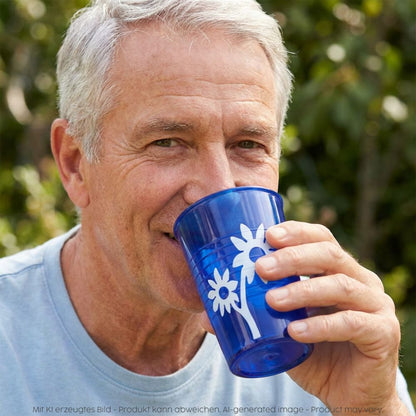 Man drinking out of the plastic cup with grip in blue 