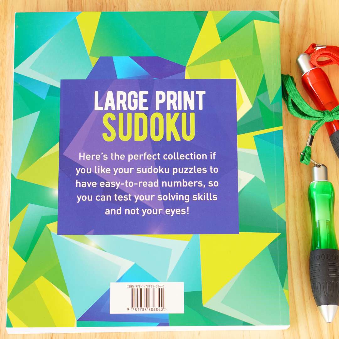 Back of the large print Sudoku book with two pens next to it