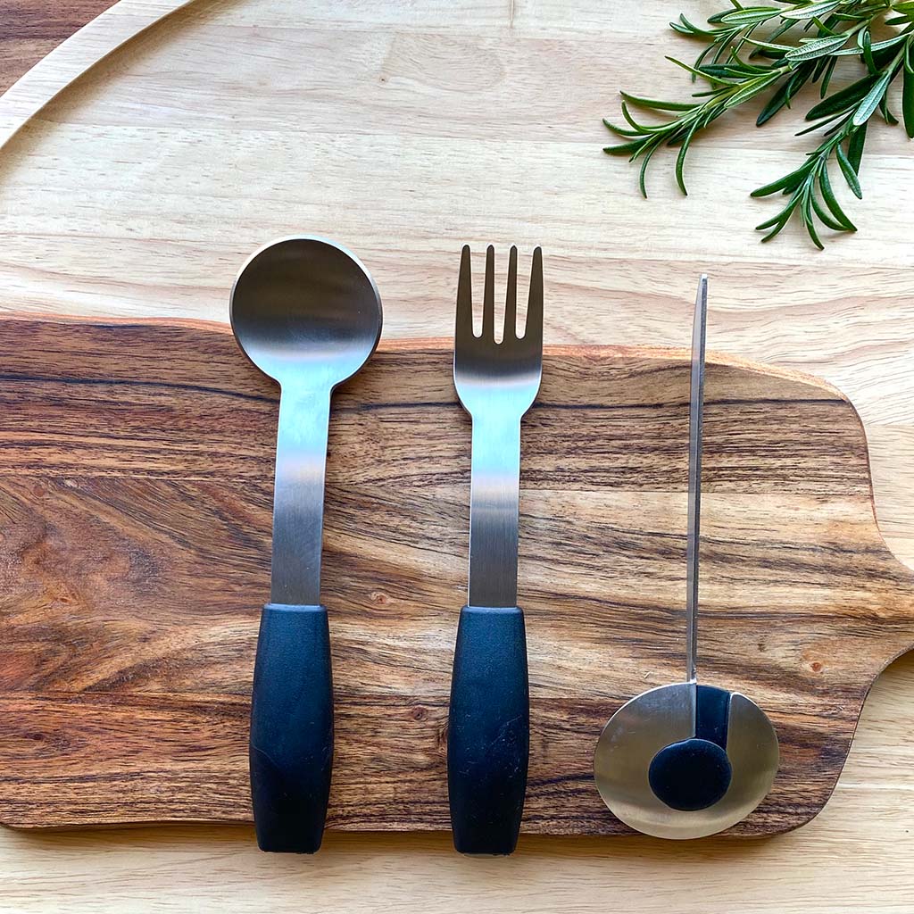 arthritis thick cutlery set on wooden chopping board