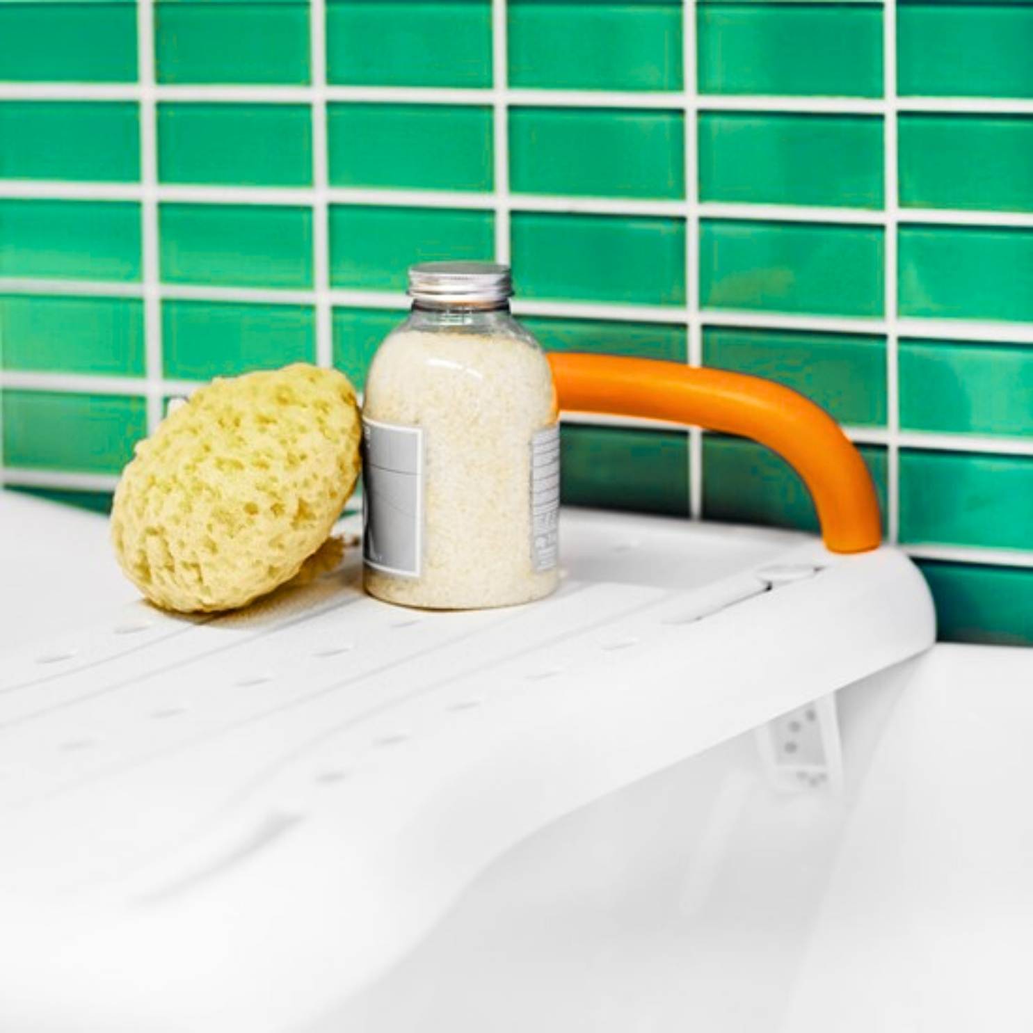 Bathtub bench across bathtub with body wash and sponge