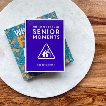 The Little Book of Senior Moments Book on a marble board
