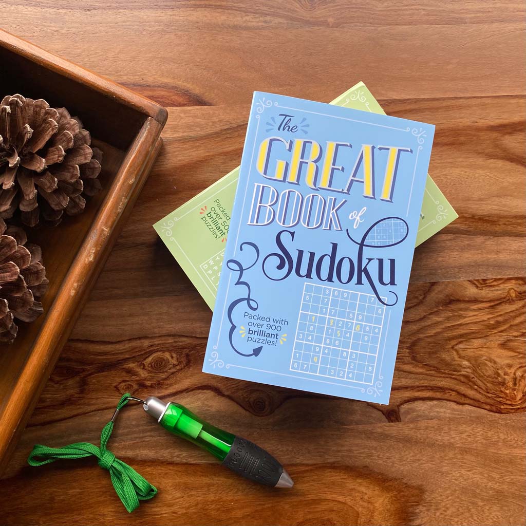 The Great Book of Sudoku on table with extra thick green pen