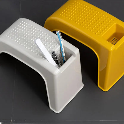 pedicure foot stools with nail care tools in storage compartment