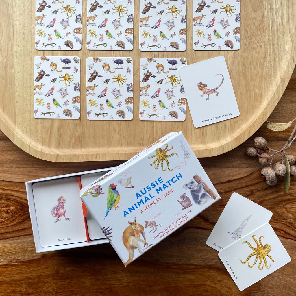 Aussie Animal Match memory matching game laid out on table with Australian gum nuts on the side