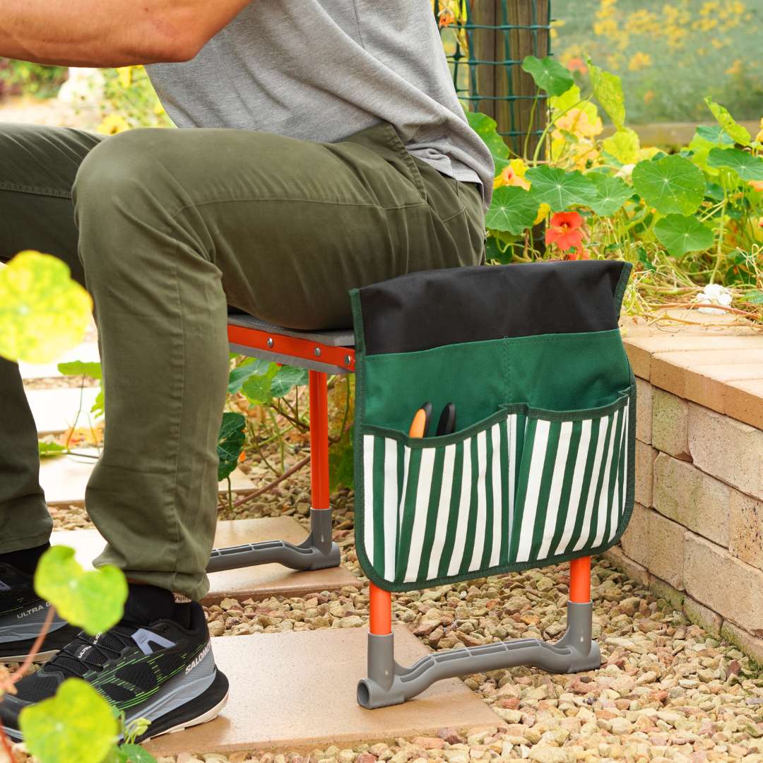 Person sitting on the garden seat kneeler and seat