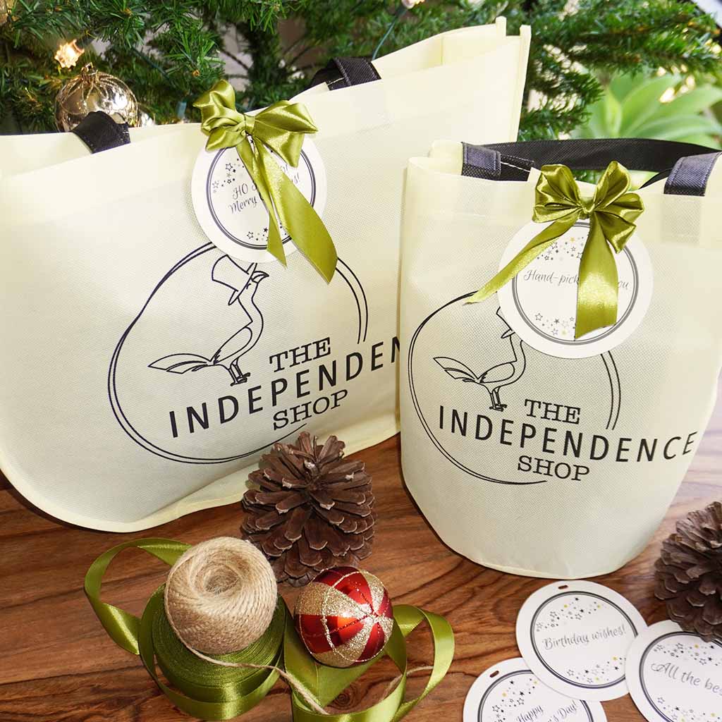 The Independence Shop gift bags with ribbon and gift tags