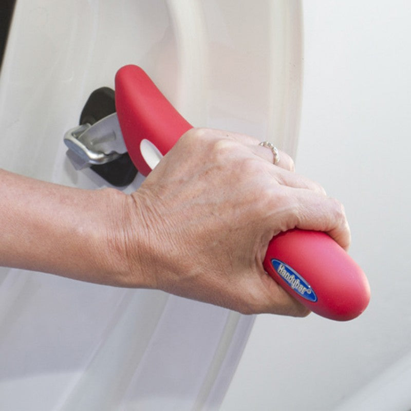 handybar used by a woman in a white car