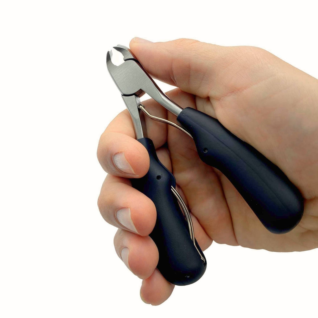 hand holding thick handled podiatrist nail clippers