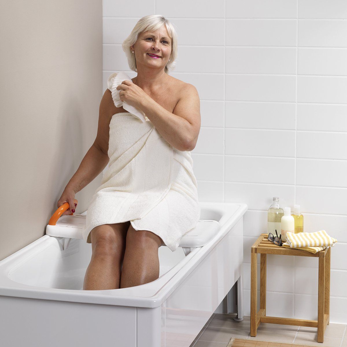 woman using the eta bath board