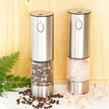 Salt and pepper mill set on marble plate