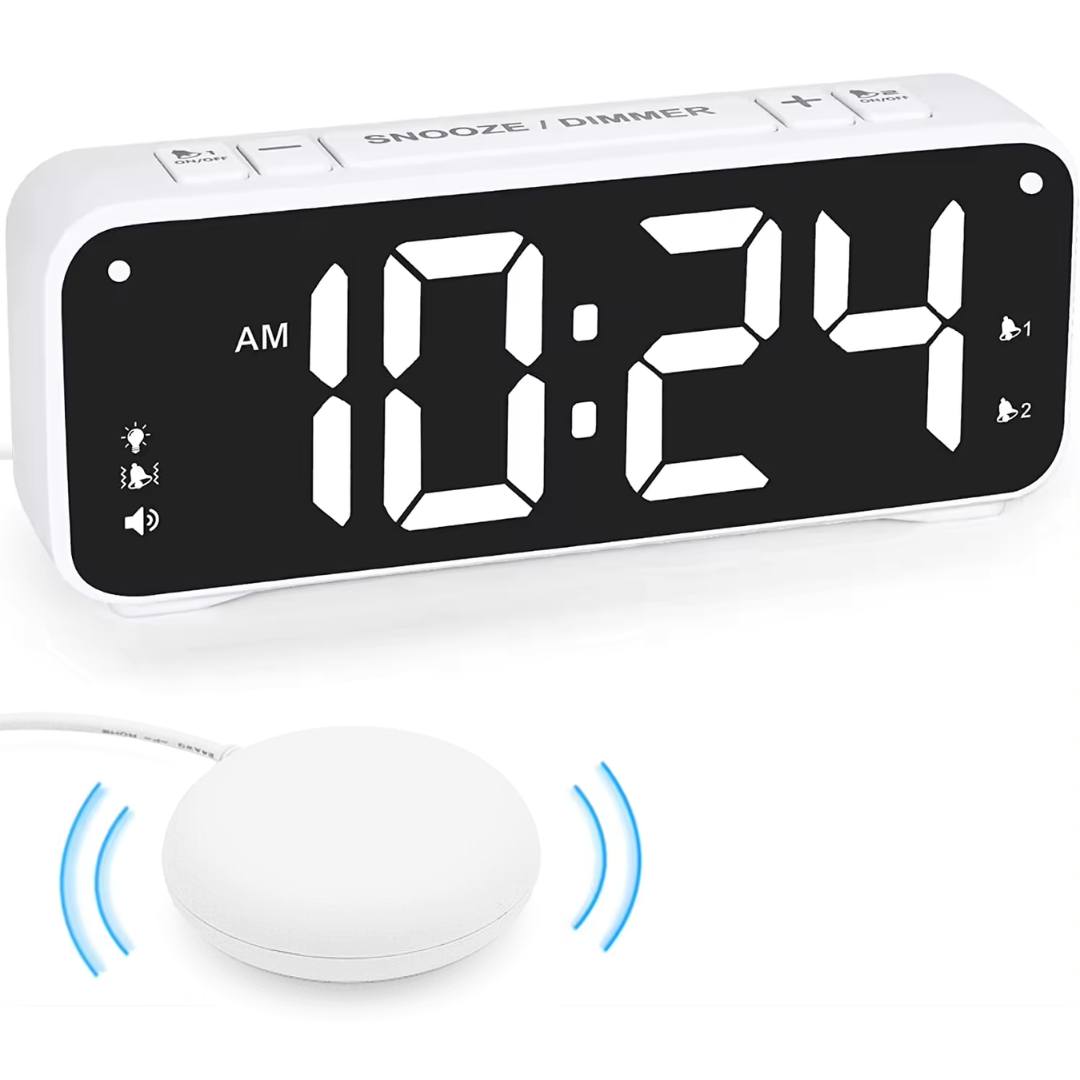 white shaker alarm clock with black shaking pad 