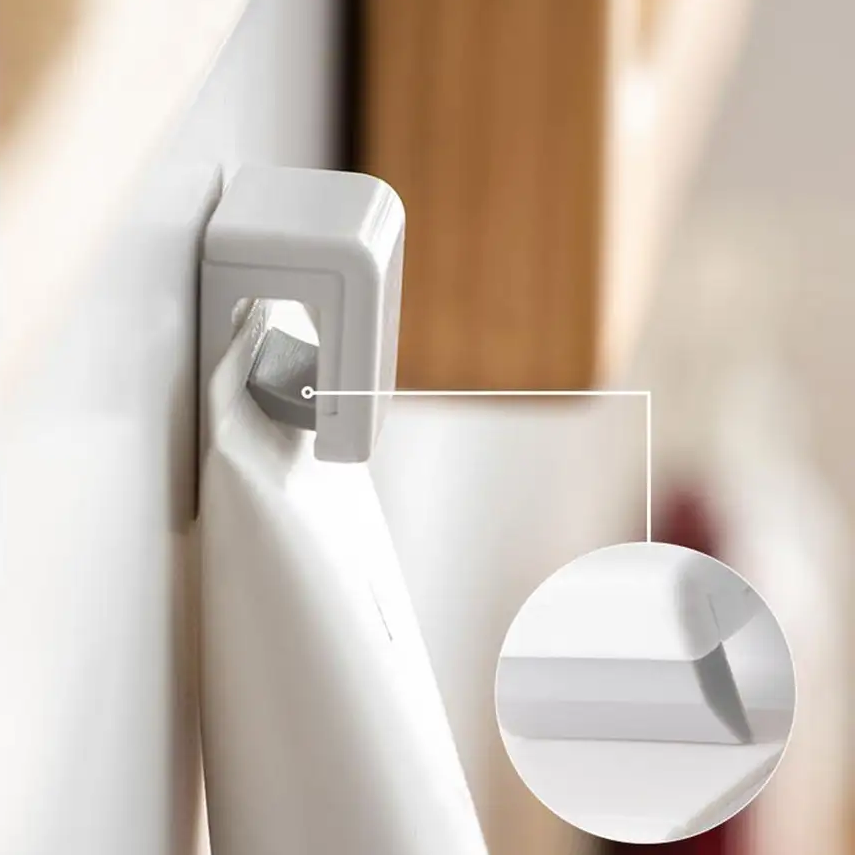strong hold plastic bathroom hook holding a tube of moisturiser